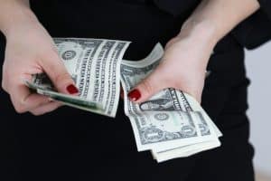 woman holding dollar bills