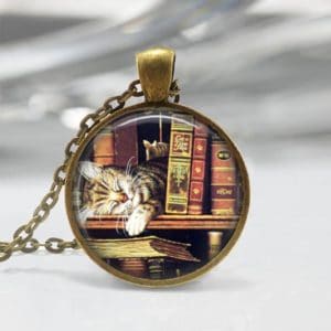 cat with library books pendant