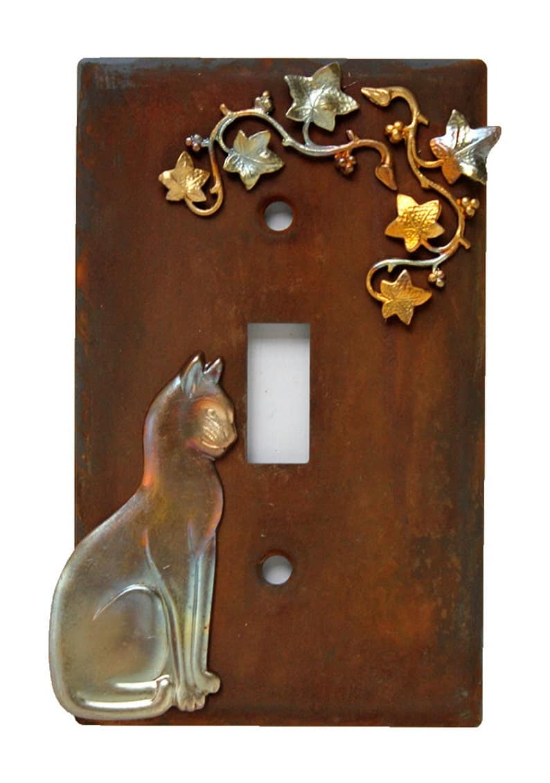 Switch plate with Cat in Left Corner, Brass Charms in Upper right corner