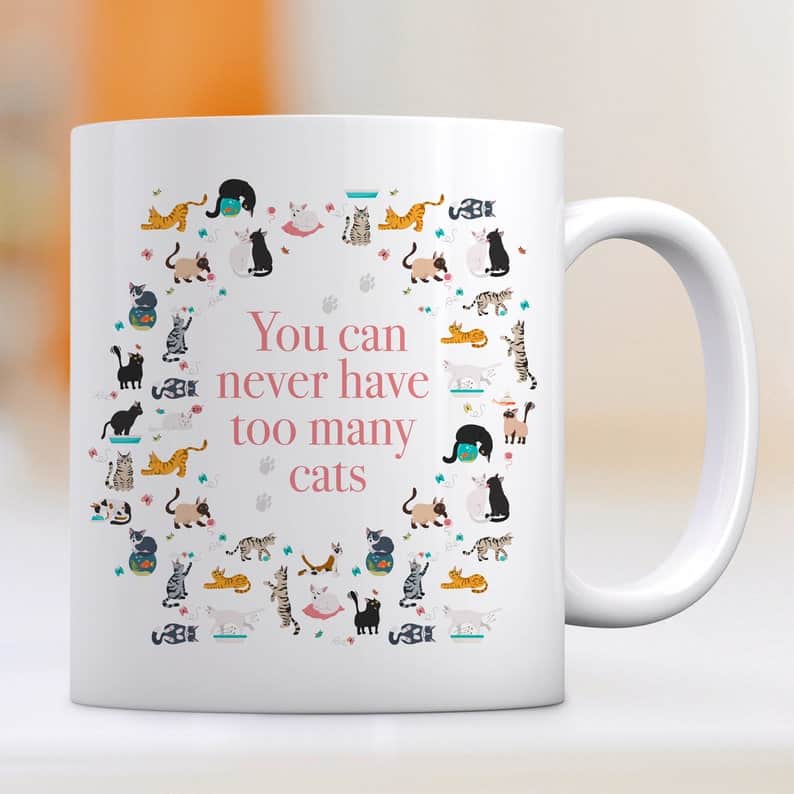 White Mug with Many Cats which says "You Can Never Have Too Many Cats"